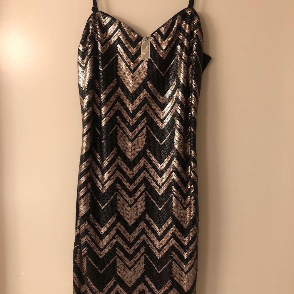 Black and gold sequin dress